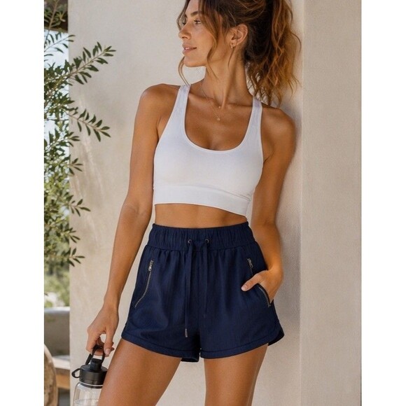 Athleta Pants - Athleta Navy  Blue Pull On Running Shorts Zip Pocket Drawstring Women’s M